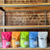 Bags of brightly packaged Opo Coffee