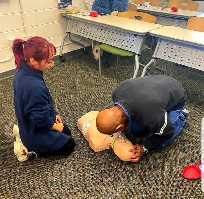 Students performing CPR